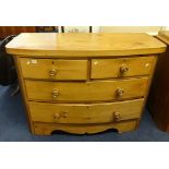 A Victorian bow fronted chest fitted with two short and two long drawers (similar to Lot 32)