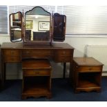 A 20th century mahogany dressing table, pair of bedside cabinets and three fold dressing mirror (