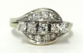 Five stone diamond ring set with a further arrangement of eight diamonds either side in white metal,