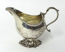 A silver helmet shaped cream jug with stem foot, SWS & Co, 6.13 oz.