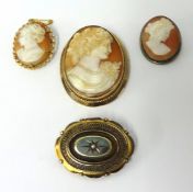 Three cameo brooches and a Victorian memoriam brooch
