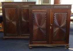A near pair of Anglo Indian padouk wood two door cupboards, one approximately 111cm wide