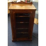 A Victorian walnut and inlaid music cabinet with single glazed door