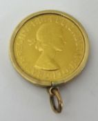 A QEII gold sovereign, 1958, set in a gold mount as a pendant