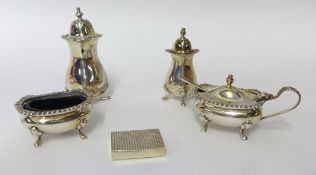 A four piece similar condiment set and a small silver snuff box (5)