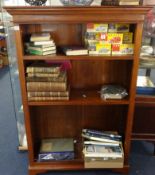 A well made teak open free standing bookcase with adjustable shelves
