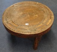 A pair of old Moroccan cartwheel coffee tables, 66cm diameter