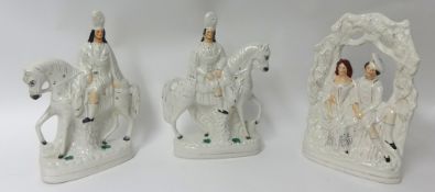 A pair of 19th century Staffordshire flatback figures of Scottish figures on horseback and a similar