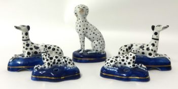 Two pairs of Dalmatian Staffordshire type quill holders and another single Dalmatian group (5)