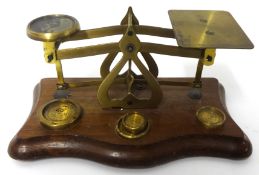 19th century brass set of letter scales with four graduated brass weights on a serpentine wood