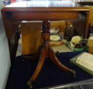 A reproduction burr walnut drop flap pedestal side table, 75cm wide opened