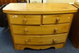 A Victorian bow fronted chest fitted with two short and two long drawers