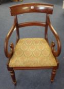 A Regency mahogany framed scroll armed carver chair with drop in seat
