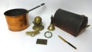 An old copper bed warmer, saucepan, various small brass objects including ornate greyhound