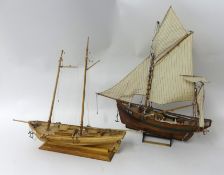 Two wood model masted ships, largest 52cm long