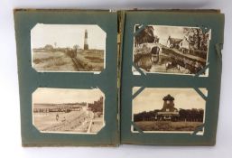 An album of various general postcards including Devon, some real photographic
