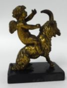 A 19th century gilt bronze figure, a winged cherub upon a ram on a plinth.18cm high including base