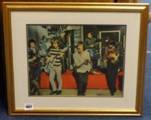 ROLLING STONES COLLECTION A coloured photograph signed by the band (faint signatures) removed from