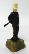 Miniature bronze? Figure of a Gentleman on an onyx stand, 10cm