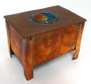 An Arts and Crafts copper cigar box on tall legs with enamelled and pewter mounted decoration to the