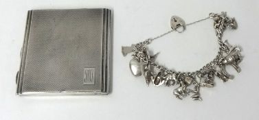 Silver cigarette case and a silver charm bracelet