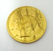 An Iranian Pahlavi gold coin, 4g (circular)