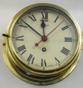 A Smiths eight day ships clock in brass case with key