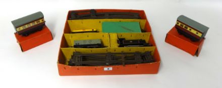 A Hornby O gauge and clockwork tinplate train set partly boxed