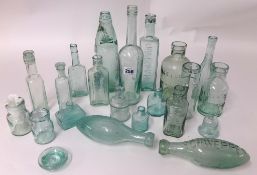 A collection of various Victorian and later green glass bottles