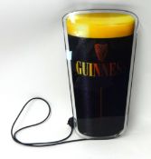 An electric Guinness pub illuminated sign