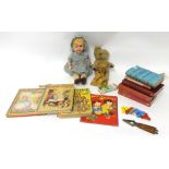 Various items including composition doll, old teddy bear, children's annuals, small Lesney diecast