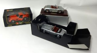 A 1/18th scale Revel BMW 507 model in metal also a Porsche Boxer on wood plinth and a Burrago