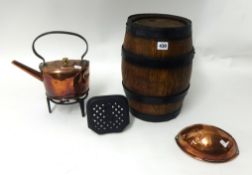 An iron bound wood cask, half flat copper kettle, a trivet and copper wall pocket (4)