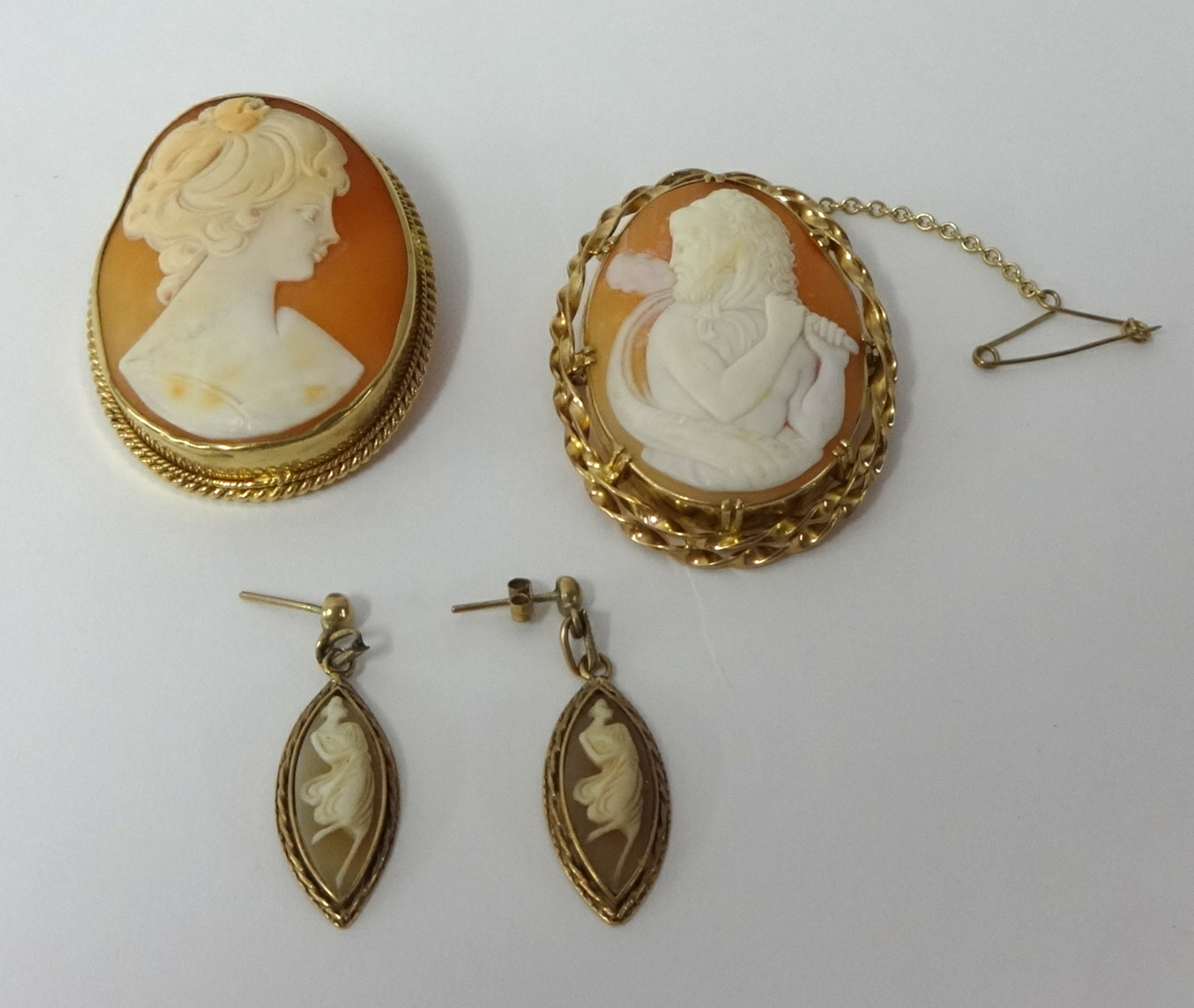 A 9ct gold framed portrait cameo t/w another cameo and a pair of silver 9ct gold mounted pendant