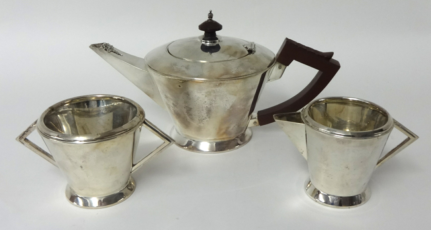 A George V silver tea set of Art Deco style circa 1933, 28 oz, makers TBA Birmingham.
