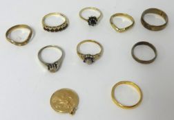 Nine 9ct gold rings including small pendant, 24g
