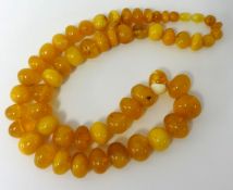 An amber style bead necklace, 93g, 66cm.