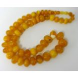 An amber style bead necklace, 93g, 66cm.