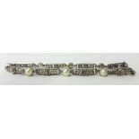 A platinum pearl and diamond bracelet circa 1900.