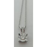 A diamond pendant necklace, set with single round cut stone, in 14k white gold, on fine chain.