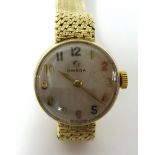 A Ladies 9ct gold Omega wrist watch in original case.