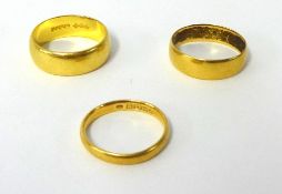 Three 22ct gold wedding bands, approx 14.7g.