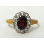 A 9ct gold and garnet cluster ring, size, Q.