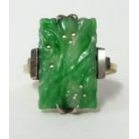 A jade ring set in yellow gold, size, N.