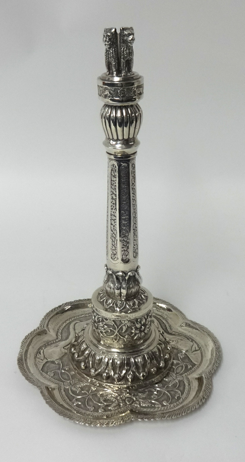 An Indian white metal (silver) centrepiece and stand, unmarked, modelled in the style of an Indian