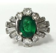 A fine emerald platinum and diamond ring , size, L set in 18ct white gold.