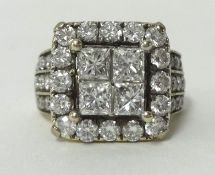 A fine and impressive diamond cluster ring, size K, set with an arrangement or 50 round cut and