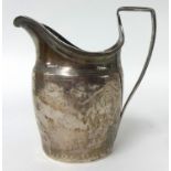 A Georgian silver cream jug with worn engraved decoration , 88.2 g.