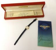 A Ladies 9ct gold Longines wrist watch with suede strap, circa 1960's, with box and delivery note