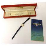 A Ladies 9ct gold Longines wrist watch with suede strap, circa 1960's, with box and delivery note